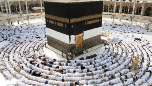 A group of Muslim worshipers perform prayers around the Kaaba at the Grand Mosque in Mecca.