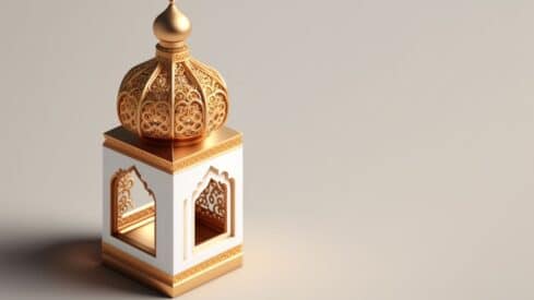 Decorative lantern with intricate gold detailing and domed top on a neutral background.