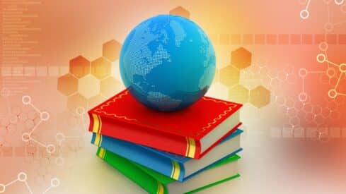 blue globe on colorful books with hexagons, binary code background.